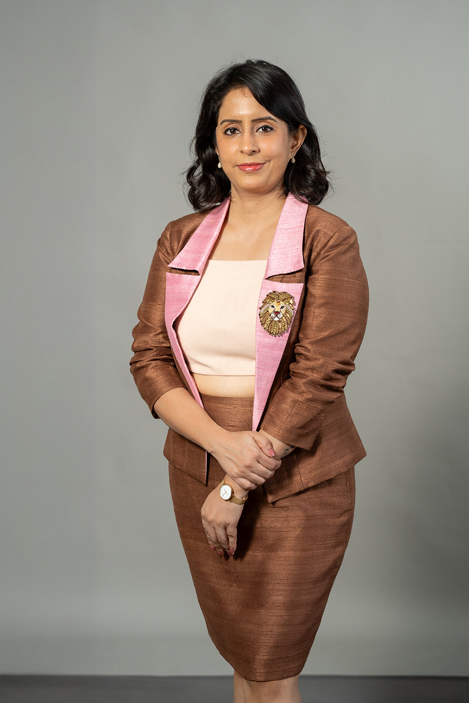 Open blazer with lion brooch