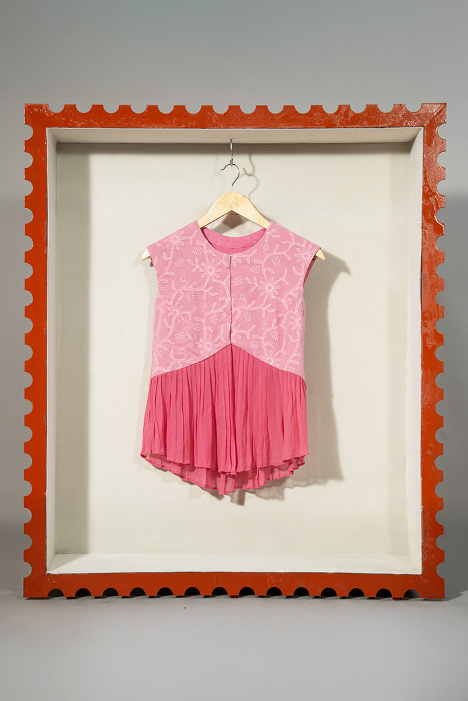 Embroidered vest with pleats