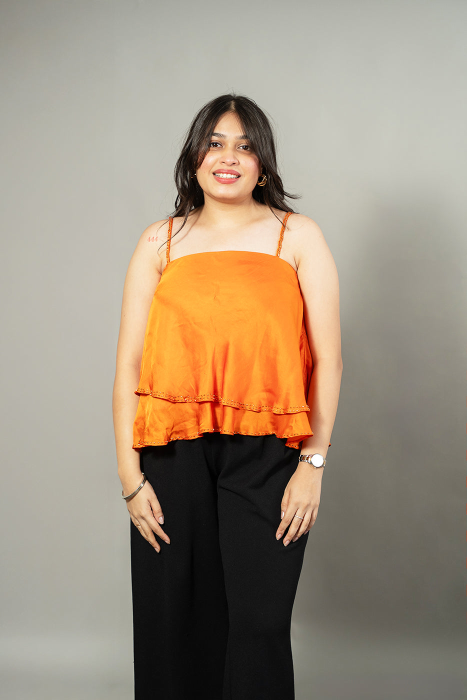 Flared asymmetrical top