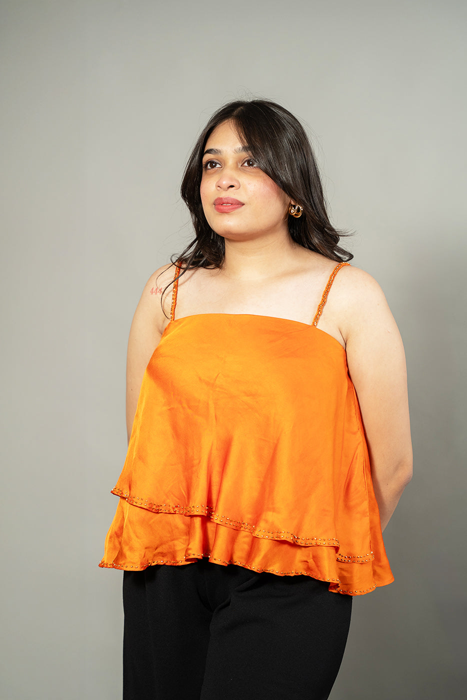 Flared asymmetrical top