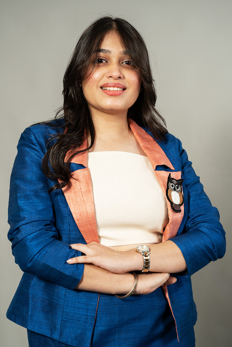 Open blazer with owl brooch