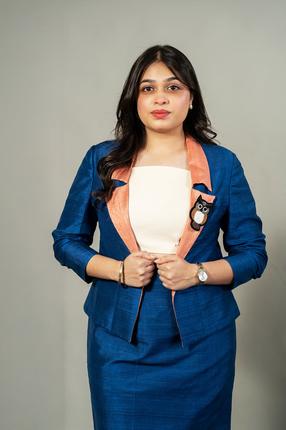 Open blazer with owl brooch