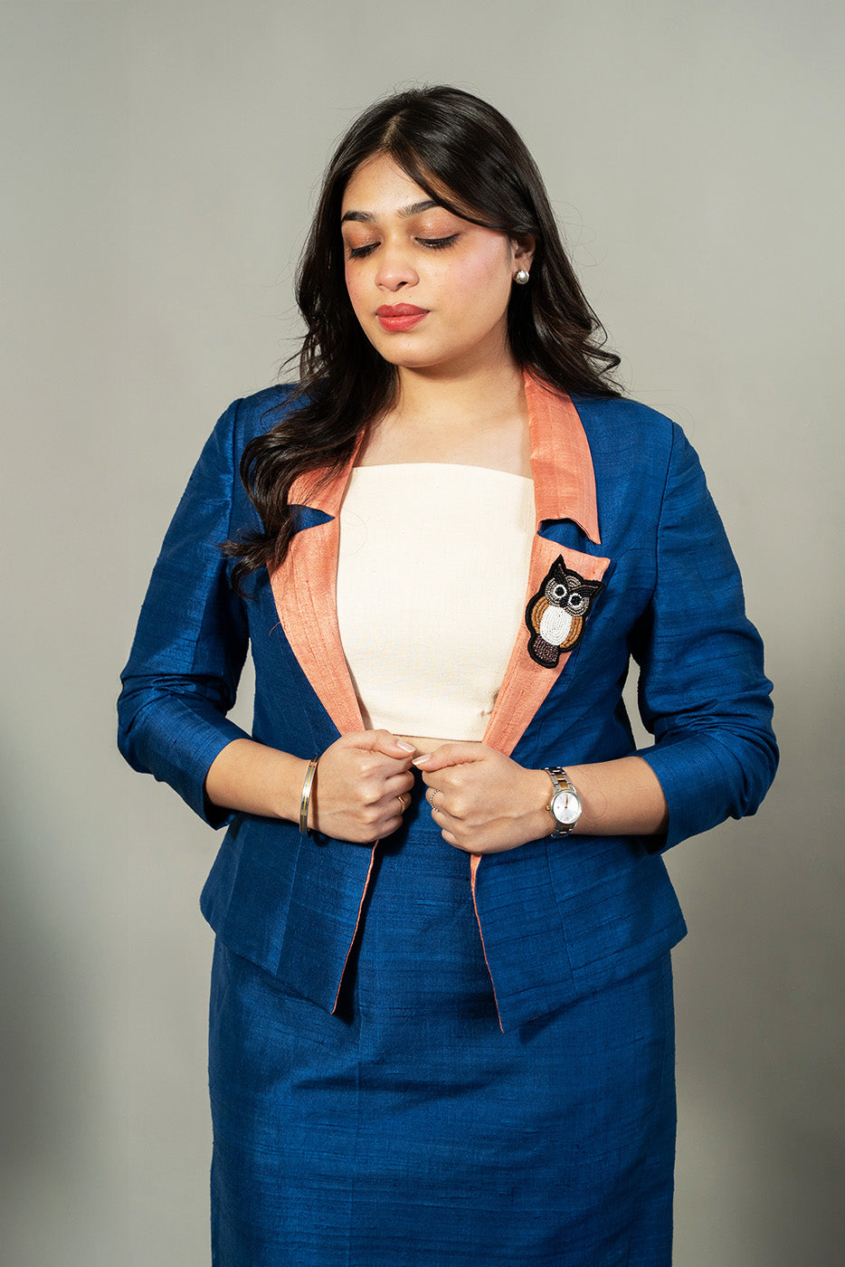 Open blazer with owl brooch